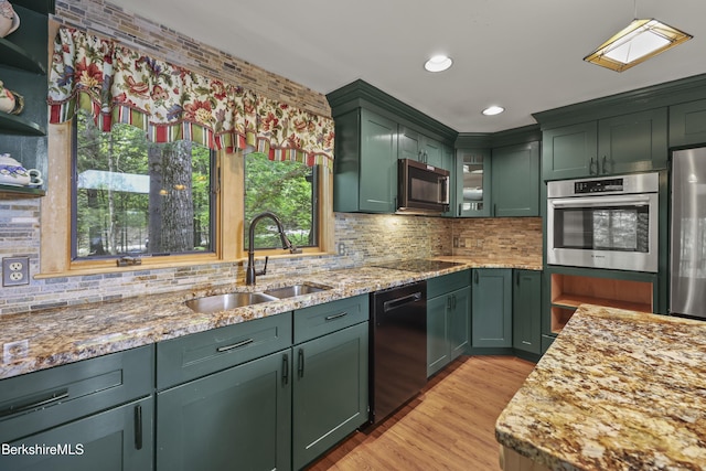 171 Lake Shore Dr, Otis, MA 01253 - kitchen with green cabinetry, black appliances, a sink, light stone countertops, and recessed lighting