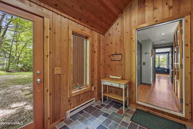 171 Lake Shore Dr, Otis, MA 01253 - foyer entrance featuring baseboard heating, wooden walls, and lofted ceiling