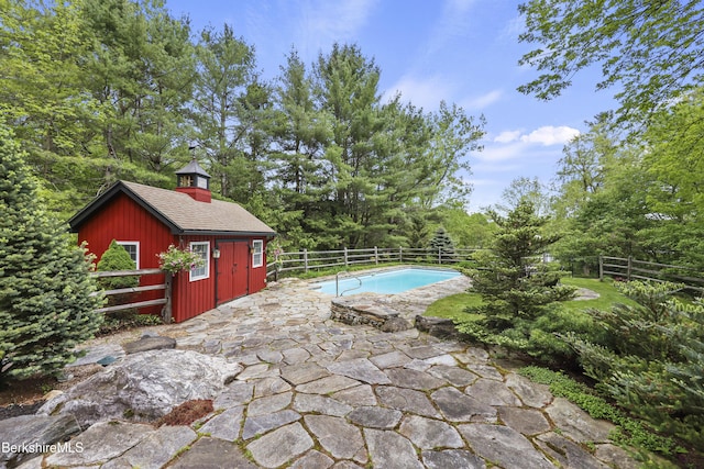 171 Lake Shore Dr, Otis, MA 01253 - view of swimming pool with a fenced backyard, an outdoor structure, and a patio area