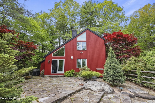 171 Lake Shore Dr, Otis, MA 01253 - back of property with a chimney and a patio area