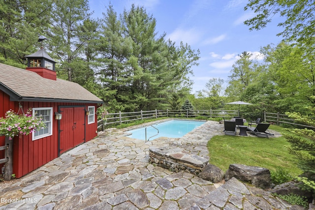 171 Lake Shore Dr, Otis, MA 01253 - view of pool featuring a fenced backyard, a patio area, and view of wooded area