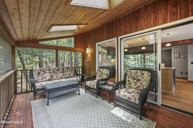 171 Lake Shore Dr, Otis, MA 01253 - sunroom / solarium with a skylight, vaulted ceiling, and an outdoor hangout area