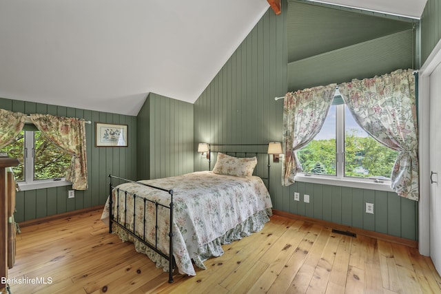 171 Lake Shore Dr, Otis, MA 01253 - bedroom featuring wood-type flooring, vaulted ceiling, and multiple windows