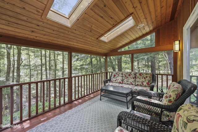 171 Lake Shore Dr, Otis, MA 01253 - sunroom with a skylight, vaulted ceiling, and an outdoor hangout area