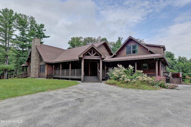 171 Lake Shore Dr, Otis, MA 01253 - log-style house with covered porch, a chimney, and a front yard