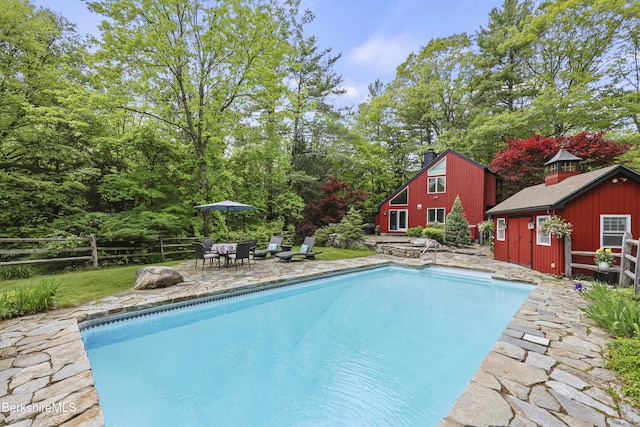 171 Lake Shore Dr, Otis, MA 01253 - outdoor pool with an outbuilding, a patio area, and outdoor dining space