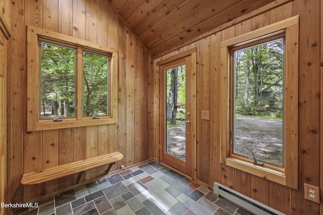 171 Lake Shore Dr, Otis, MA 01253 - foyer entrance with baseboard heating, lofted ceiling, dark stone finish flooring, and wood walls