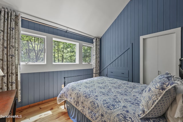 171 Lake Shore Dr, Otis, MA 01253 - bedroom with wood finished floors, vaulted ceiling, and wood walls