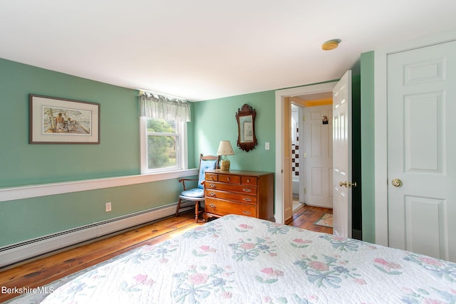 367 N Plain Rd, Great Barrington, MA 01236 - bedroom featuring a baseboard heating unit and wood finished floors