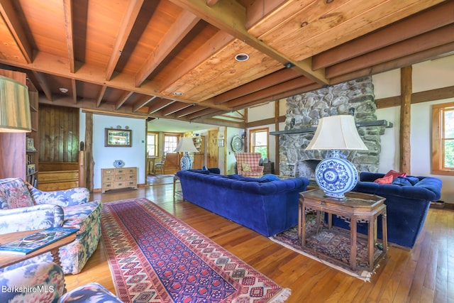 144 Shore Rd, Richmond, MA 01254 - living area with beamed ceiling, wood-type flooring, and a fireplace