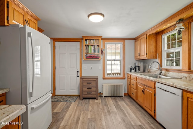 160 Marion Ave, North Adams, MA 01247 - kitchen featuring white appliances, radiator heating unit, light wood finished floors, light countertops, and plenty of natural light