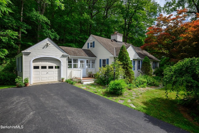 160 Marion Ave, North Adams, MA 01247 - view of front of home with an attached garage, a chimney, driveway, and roof with shingles