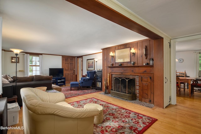 160 Marion Ave, North Adams, MA 01247 - living room with crown molding, plenty of natural light, light wood-style flooring, and a fireplace