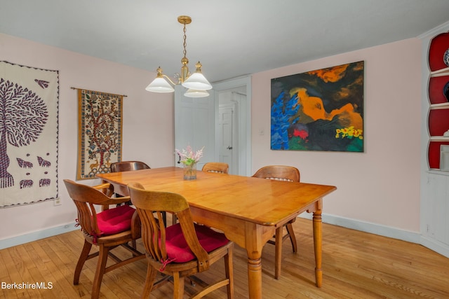 160 Marion Ave, North Adams, MA 01247 - dining area with light wood finished floors and a chandelier