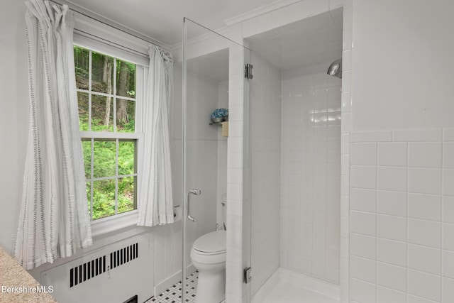 160 Marion Ave, North Adams, MA 01247 - full bathroom featuring radiator heating unit, a stall shower, ornamental molding, and tile walls