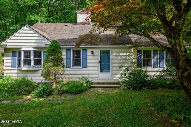 160 Marion Ave, North Adams, MA 01247 - view of front of house with a chimney, a front yard, and a shingled roof