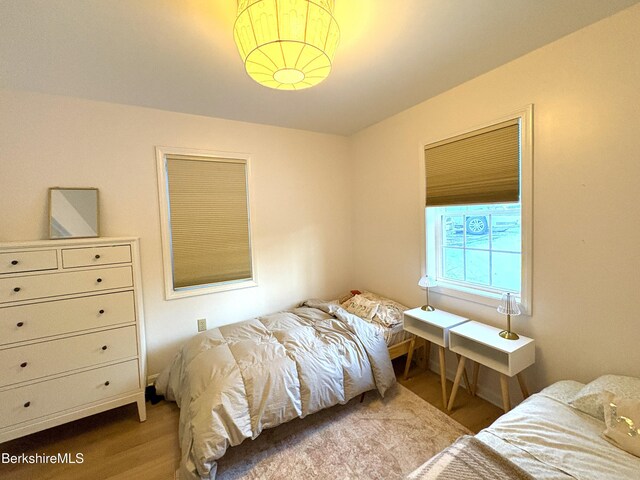 bedroom with light hardwood / wood-style floors