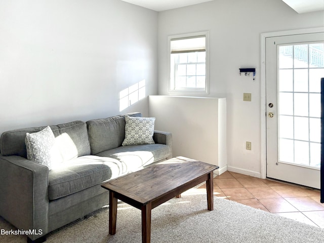 tiled living room with plenty of natural light