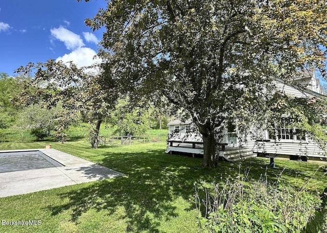 view of yard with a wooden deck
