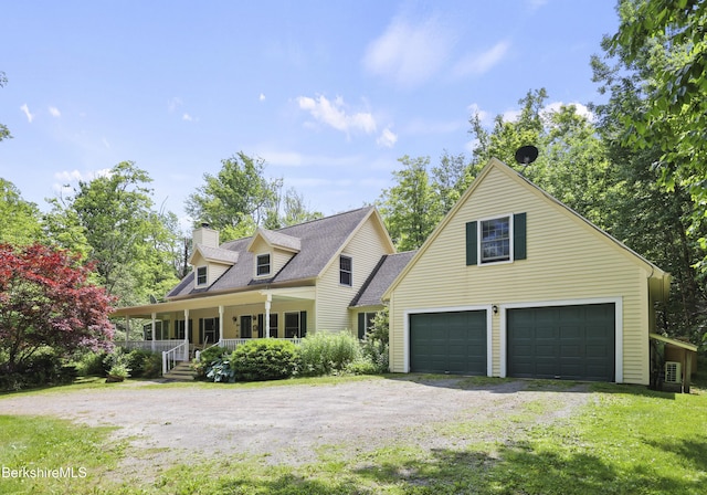 169 Jacobs Hollow Rd, Becket, MA 01223 - view of front facade with a porch, a chimney, a garage, dirt driveway, and a shingled roof