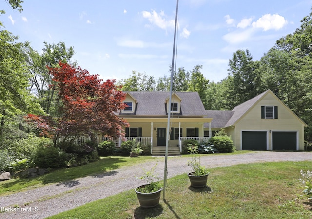 169 Jacobs Hollow Rd, Becket, MA 01223 - cape cod home with a garage, gravel driveway, covered porch, a front lawn, and roof with shingles