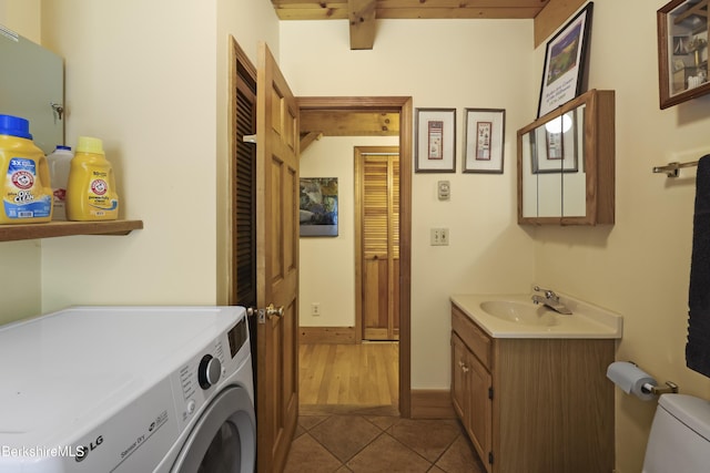 169 Jacobs Hollow Rd, Becket, MA 01223 - laundry room with tile patterned floors, washing machine and dryer, and cabinet space
