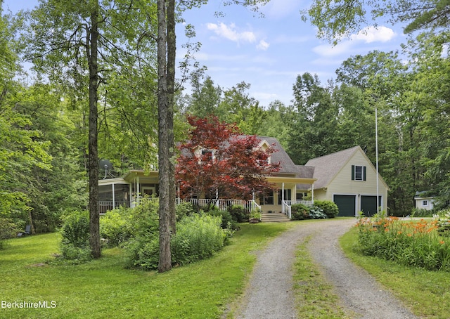 169 Jacobs Hollow Rd, Becket, MA 01223 - view of front of house featuring a porch, driveway, a garage, and a front yard