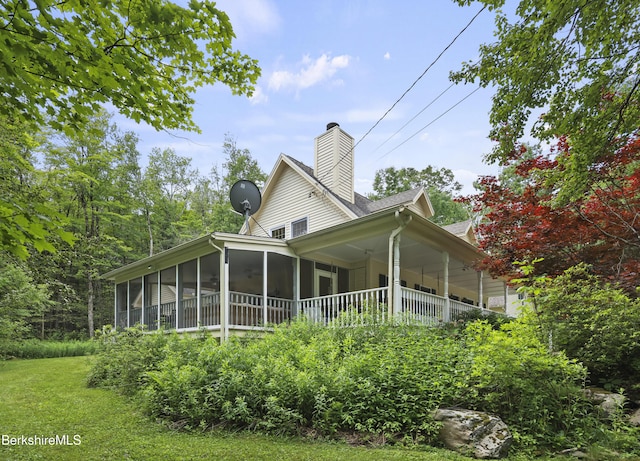 169 Jacobs Hollow Rd, Becket, MA 01223 - view of side of property with a chimney and a sunroom