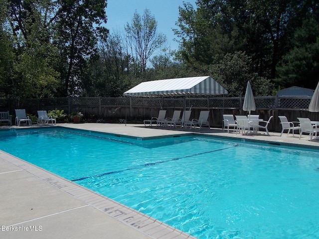 1136 Barker Rd Unit 65, Pittsfield, MA 01201 - community pool with a patio area and outdoor dining space