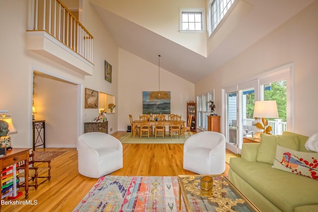 1136 Barker Rd Unit 65, Pittsfield, MA 01201 - living room featuring high vaulted ceiling and wood finished floors