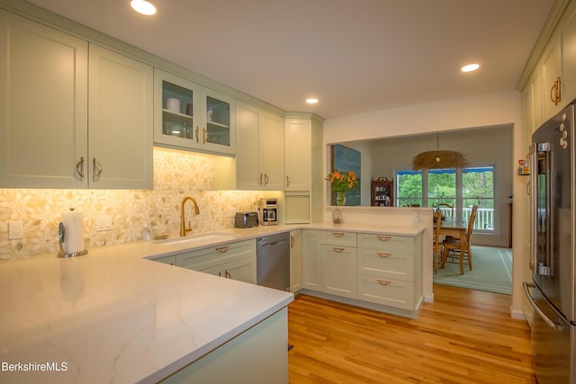 1136 Barker Rd Unit 65, Pittsfield, MA 01201 - kitchen featuring stainless steel appliances, light wood-style floors, a peninsula, tasteful backsplash, and recessed lighting