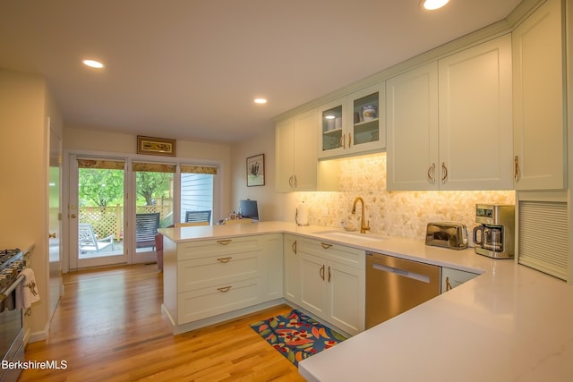 1136 Barker Rd Unit 65, Pittsfield, MA 01201 - kitchen featuring stainless steel appliances, a peninsula, decorative backsplash, light countertops, and recessed lighting