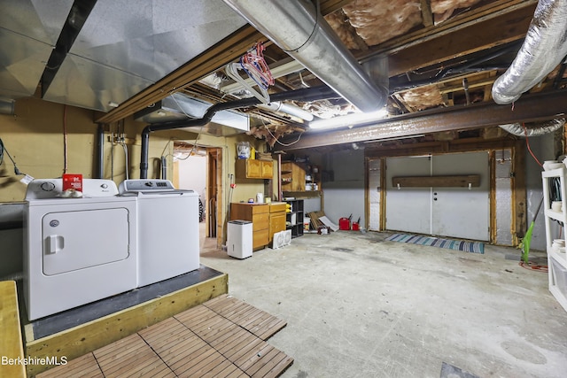 unfinished basement featuring washer and dryer