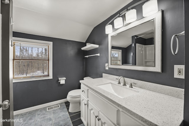 bathroom with baseboards, visible vents, toilet, vaulted ceiling, and vanity