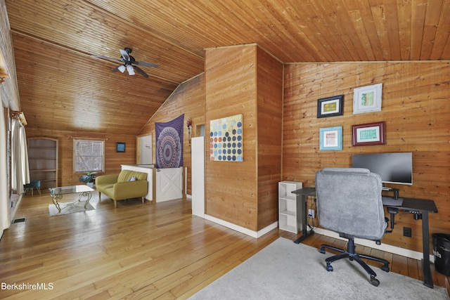 office area with wooden ceiling, vaulted ceiling, wooden walls, and hardwood / wood-style floors