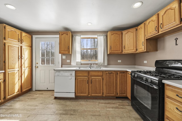 kitchen featuring white dishwasher, a sink, light countertops, black range with gas stovetop, and plenty of natural light