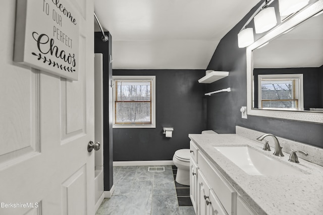 bathroom featuring baseboards, visible vents, toilet, vaulted ceiling, and vanity