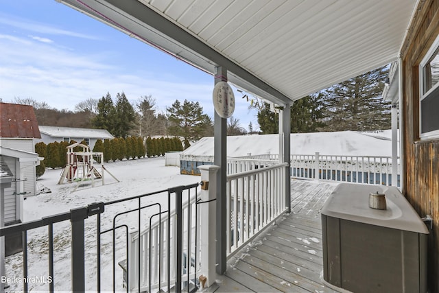 view of snow covered deck