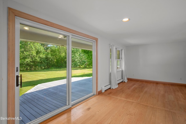 92 Hancock Rd, Williamstown, MA 01267 - doorway to outside with light wood-style floors, a baseboard radiator, and recessed lighting
