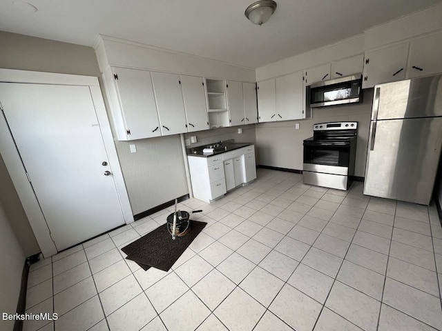 kitchen featuring light tile patterned flooring and appliances with stainless steel finishes