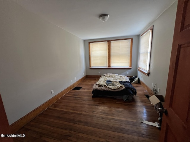 bedroom featuring dark wood-type flooring