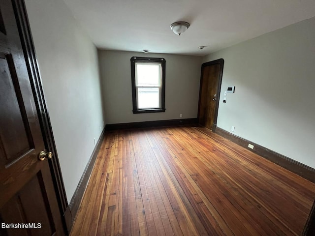 empty room with wood-type flooring