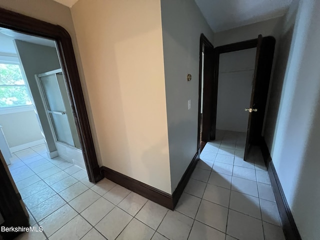 hallway with light tile patterned floors