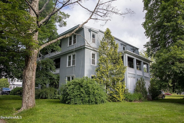 6-10 Manville St, Great Barrington, MA 01230 - view of side of home featuring mansard roof, a yard, and stucco siding