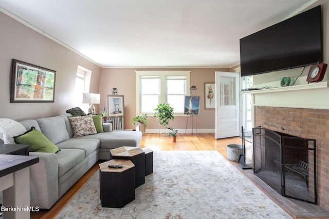 6-10 Manville St, Great Barrington, MA 01230 - living room with wood finished floors, a brick fireplace, and ornamental molding