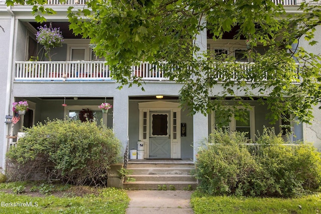 6-10 Manville St, Great Barrington, MA 01230 - view of front of property featuring a balcony and stucco siding