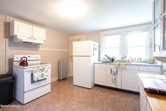 6-10 Manville St, Great Barrington, MA 01230 - kitchen featuring white appliances, under cabinet range hood, radiator heating unit, white cabinetry, and light countertops