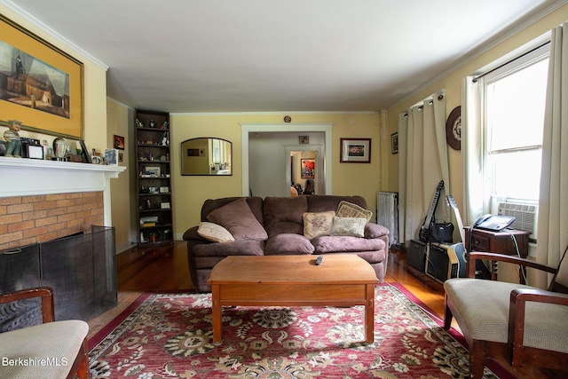 6-10 Manville St, Great Barrington, MA 01230 - living room with wood finished floors, built in features, ornamental molding, a brick fireplace, and cooling unit
