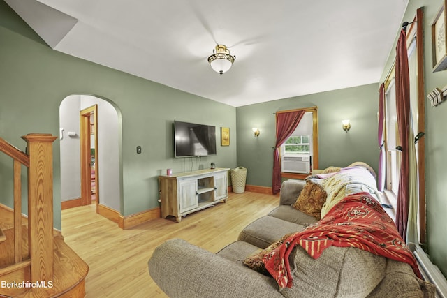 5 N St, Adams, MA 01220 - living area featuring light wood-style flooring, arched walkways, stairway, and cooling unit