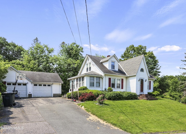 5 N St, Adams, MA 01220 - cape cod home with an outbuilding, a detached garage, a front lawn, a chimney, and a shingled roof